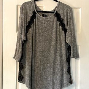 Gray sweater with black lace appliqué